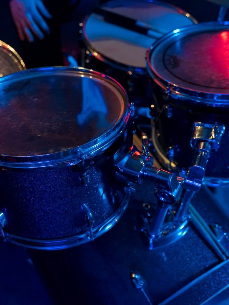 A drum kit on a lit stage